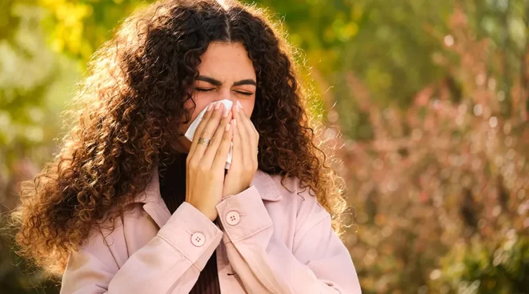 Woman sneezing