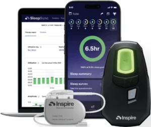 black inspire remote and gray inspire device in front of a phone and tablet showcasing the mobile app